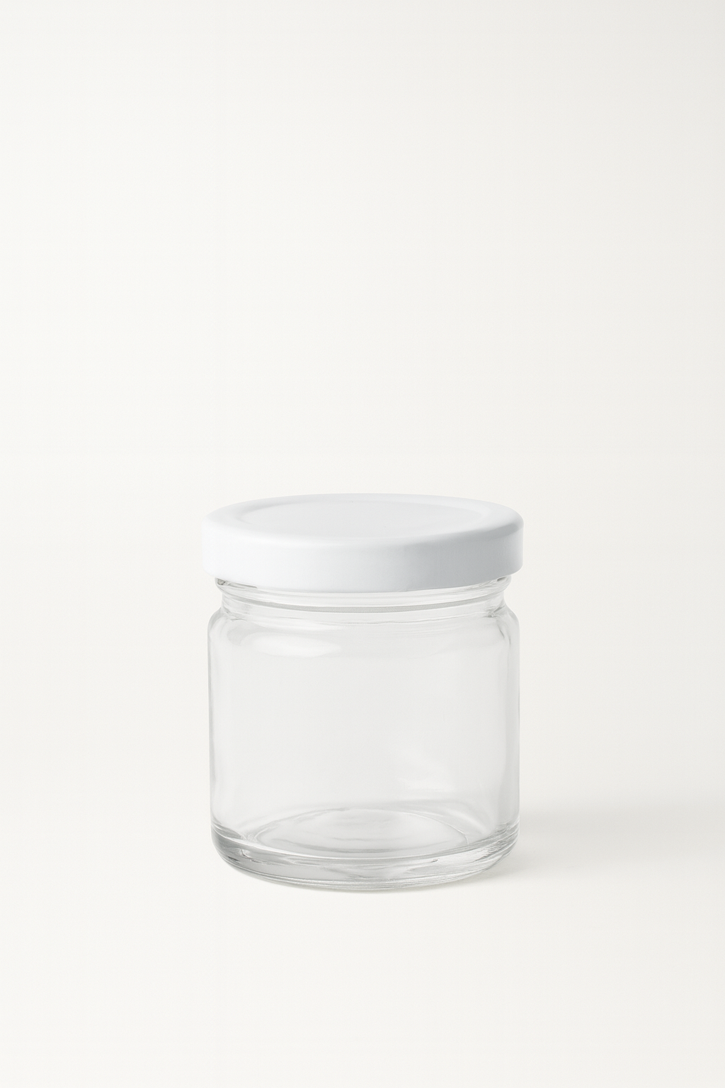 Tarrito de vidrio transparente con tapa blanca 1.5 oz