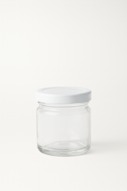Tarrito de vidrio transparente con tapa blanca 1.5 oz